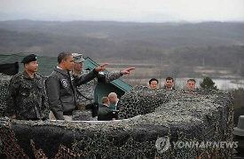 US President Barack Obama looks towards North Korea from Observation Post Ouellette during a visit to the Joint Security Area of the demilitarised zone