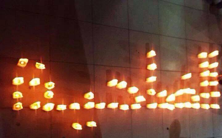 Candles writing the word Dahiyeh in Arabic - Mohammad Diyab
