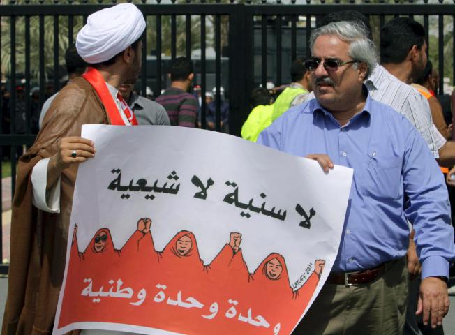 Ibrahim Sharif and Sheikh ALi Salman during a pro-democracy rally in March 2011