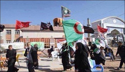 En photos:les visiteurs de l’Imam Hussein brandissent les drapeaux de leurs pays
