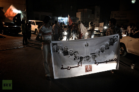 Rally of Freedom in solidarity with jailed Bahraini human rights and political activists in the village of Bilad al-Qadim, a suburb of Manama, in the early hours of August 13, 2012 (AFP)