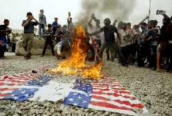 Iraqis burning the US flag