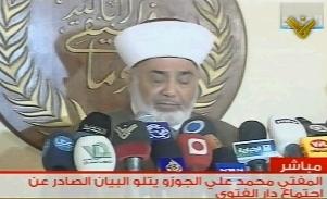 Cleric Mohammad Ali Al-Jozo reading the Council of Muftis meeting statement