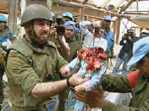 a baby taken out from rubble