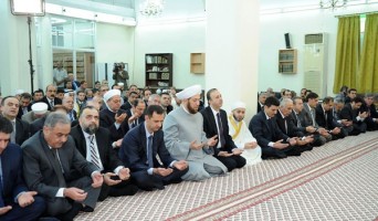 Syrian President Bashar Al-Assad performing Eid al-Fitr prayers in Damascus; August 19, 2012