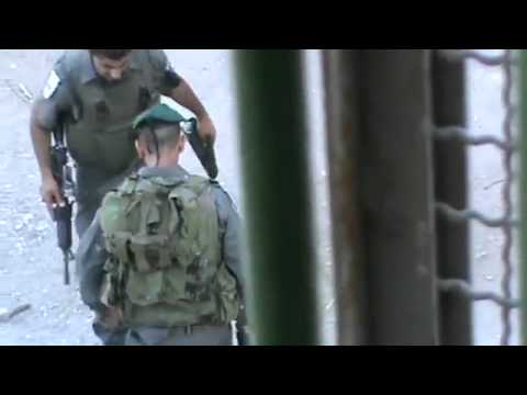 Two Israeli Officers Attack Palestinian Kid