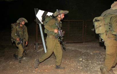 Zionist occupation soldiers withdrawing from Southern Lebanon; May 2000