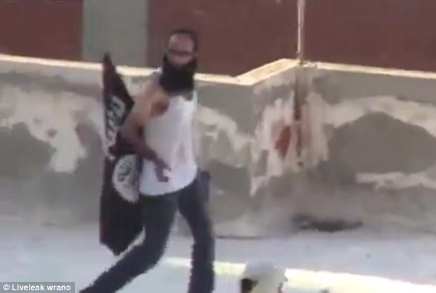 One of the men, waving al-Qaeda flag