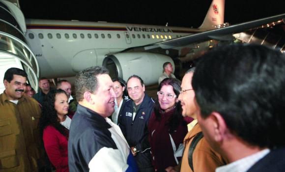 Chavez Returns to Venezuela, Says to Continue Treatment There
