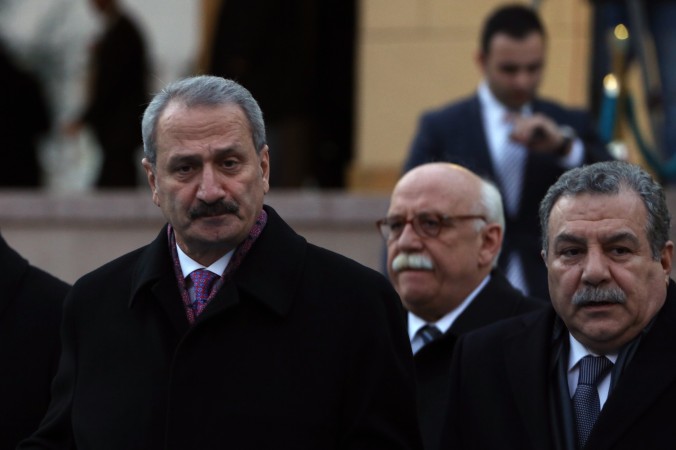 Economy Minister Zafer Caglayan, left, Education Minister Nabi Avci, center, and Interior Minister Muammer Guler 