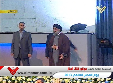 Hezbollah Secretary General Sayyed Hasan Nasrallah appears before crowds in Beirut; August 2, 2013