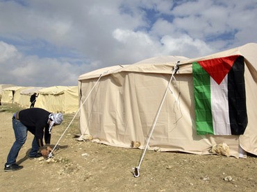 Palestinian activist secures a rope in E1 area; Jan. 11, 2013