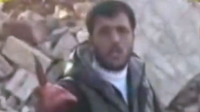 Syria: militiaman Khalid Hamad carrying the heart of a killed Syrian soldier