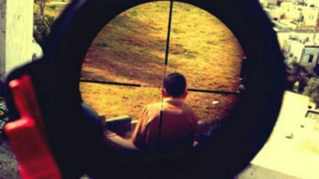 Israeli Soldier Shows off Photo of Pal. Boy in Rifle Crosshairs
