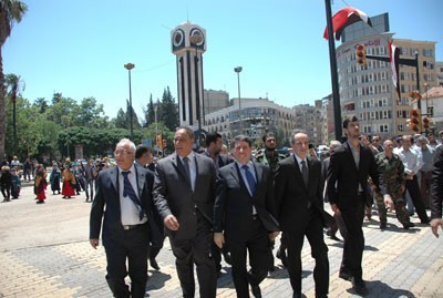 PM Tours Central Homs, Raises Syrian Flag in Martyrs Square