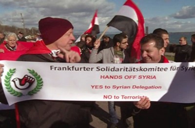 Scores of People Rally at UN HQ in Geneva, Support Syria’s Official Delegation