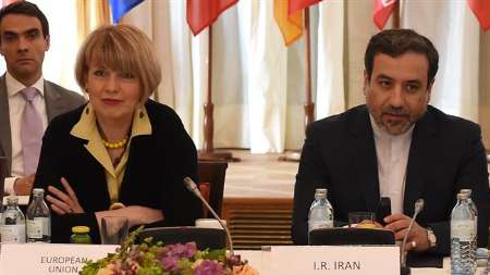 Deputy for EU foreign policy chief Helga Schmid (L), Iranian Foreign Ministry Deputies Abbas Araqchi (R) in Vienna