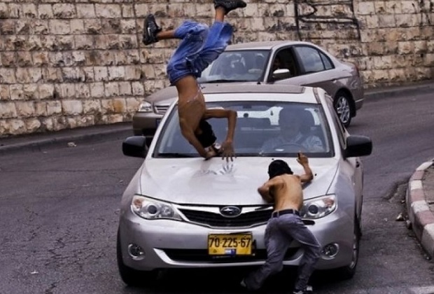 Israeli Settler Runs over Palestinian Youth