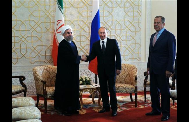 Iranian President Sheikh Hassan Rouhani (L), Russian President Vladimir Putin (R)