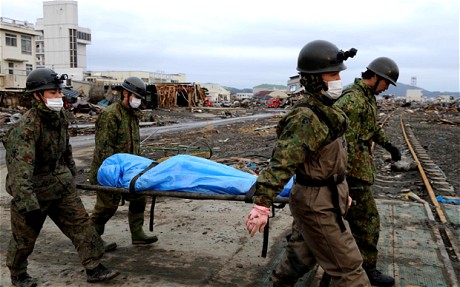 Quake-Ravaged Japan Buries Victims in Mass Grave
