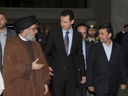 Haaretz: Assad Played Major Role with Hezbollah in Hariri Murder
