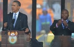 Interprète imposteur près d’Obama: responsabilité des
Sud-Africains (police)