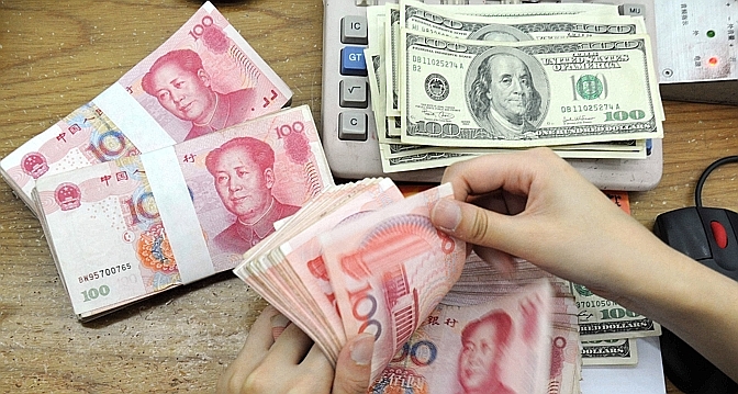 La Chine relève le niveau du yuan au plus haut face à un dollar en berne
